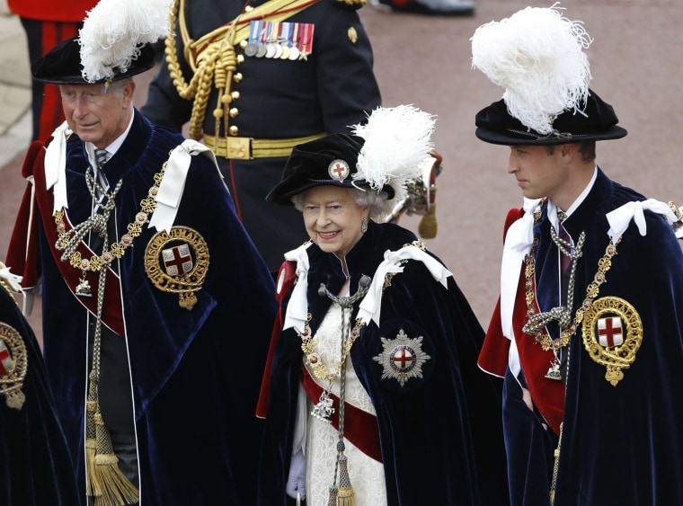 Image: Britain's Queen Elizabeth walks in procession with Prince Charles and Prince William as they attend the annual Order of the Garter Service at St George's Chapel at Windsor Castle in Windsor